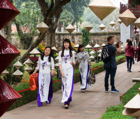 Vietnamese women in national clothes at the Temple of Literature in Hanoi